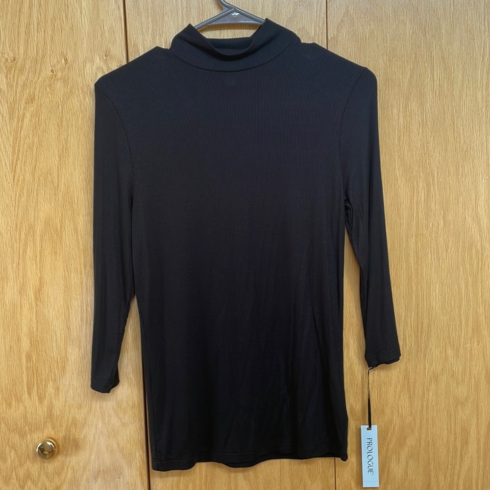 Prologue black turtle neck, small sleeves come up midway on arms. Not worn!